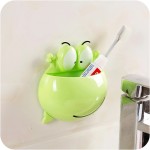 Toothbrush and toothpaste holder, frog head, green color